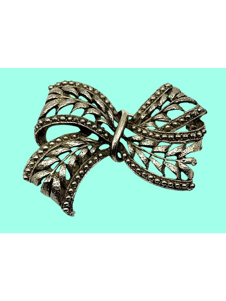 Vintage Hobe 1960s Silver-Tone Bow Brooch With Intricate Filigree Design